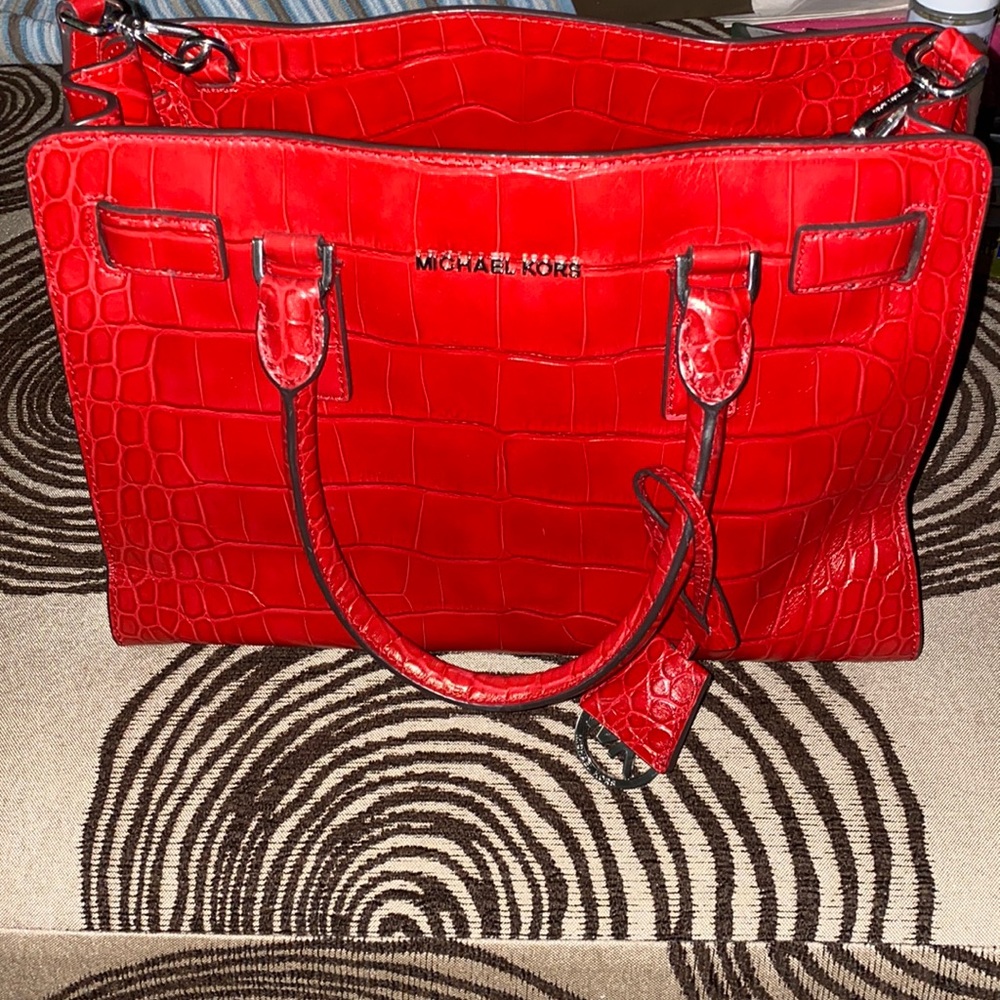 Red Michael Kors shoulder bag.